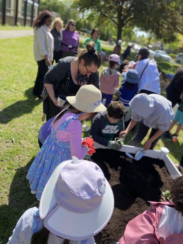 People are planting. Open Gallery