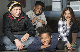 Four students smiling for photo