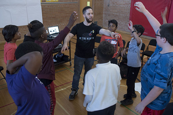 a teacher connects with a group of students 