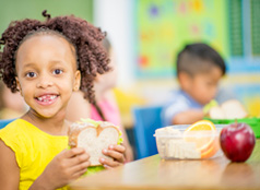 Child holding a sandwich