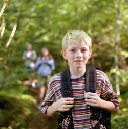 student outdoors with backpack