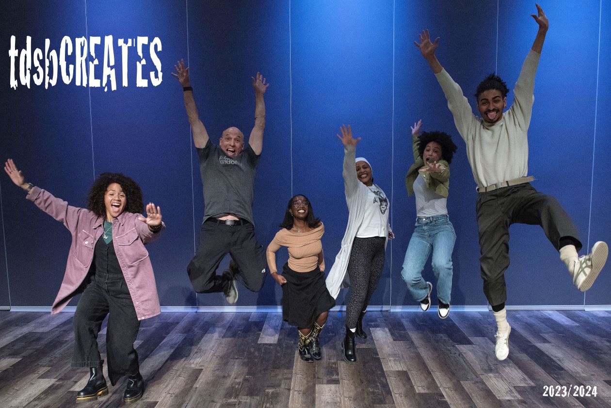 TDSB Creates Conference photo of participants jumping on stage