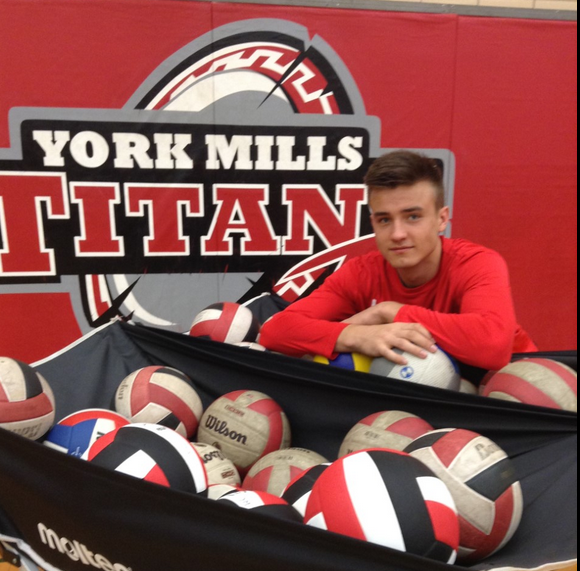 Athlete of the year Cole Ketrzynski from York Mills CI posing with volleyballs.